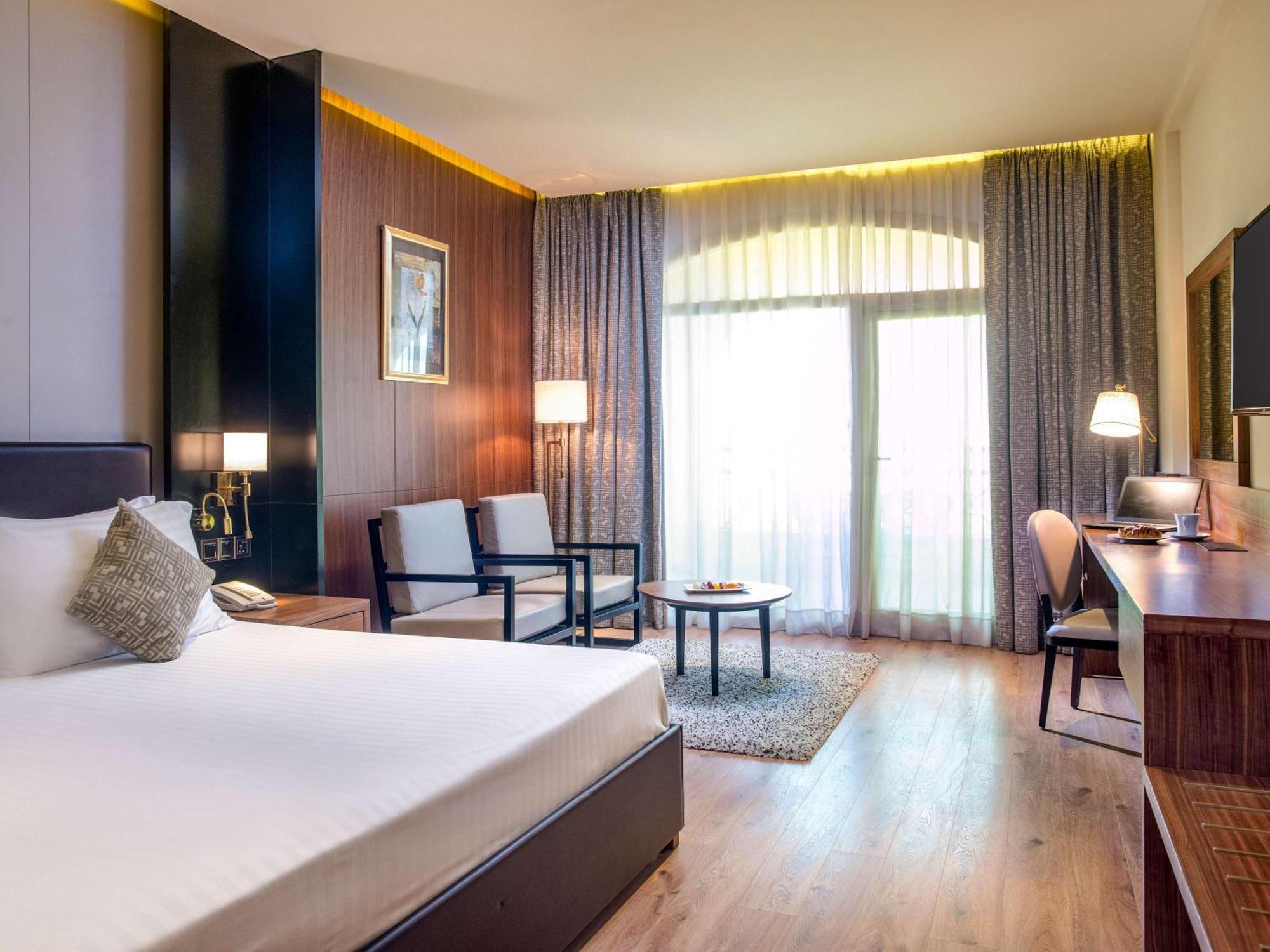 Moevenpick Hotel Cairo - Media City Giza Exterior photo A room at the hotel