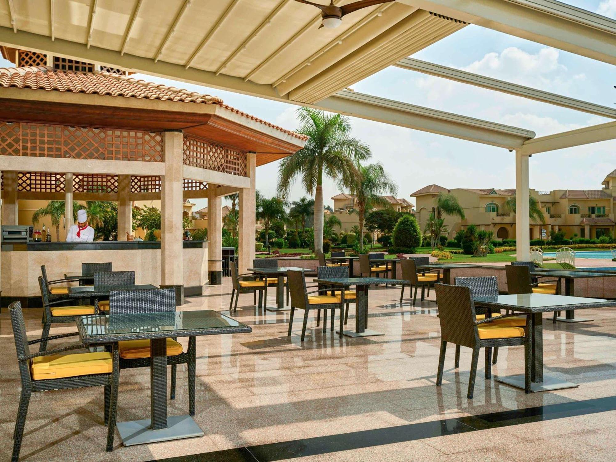 Moevenpick Hotel Cairo - Media City Giza Exterior photo The poolside bar at the Hilton Luxor